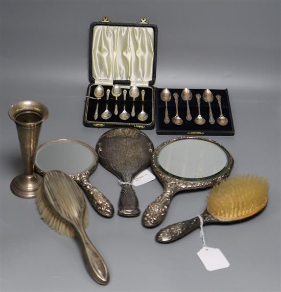 Two sets of silver coffee spoons, five hair brushes and a silver vase.
